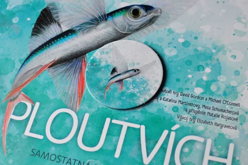 Na ploutvích - žeton začínajícího hráče