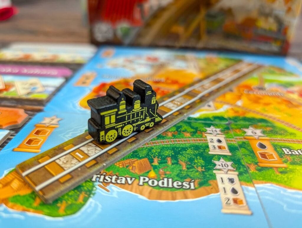 Ostrovní Expres: Nastupovat! - figurka lokomotivy pokroku, určující konec partie